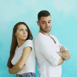 A man and woman turning their back from each other