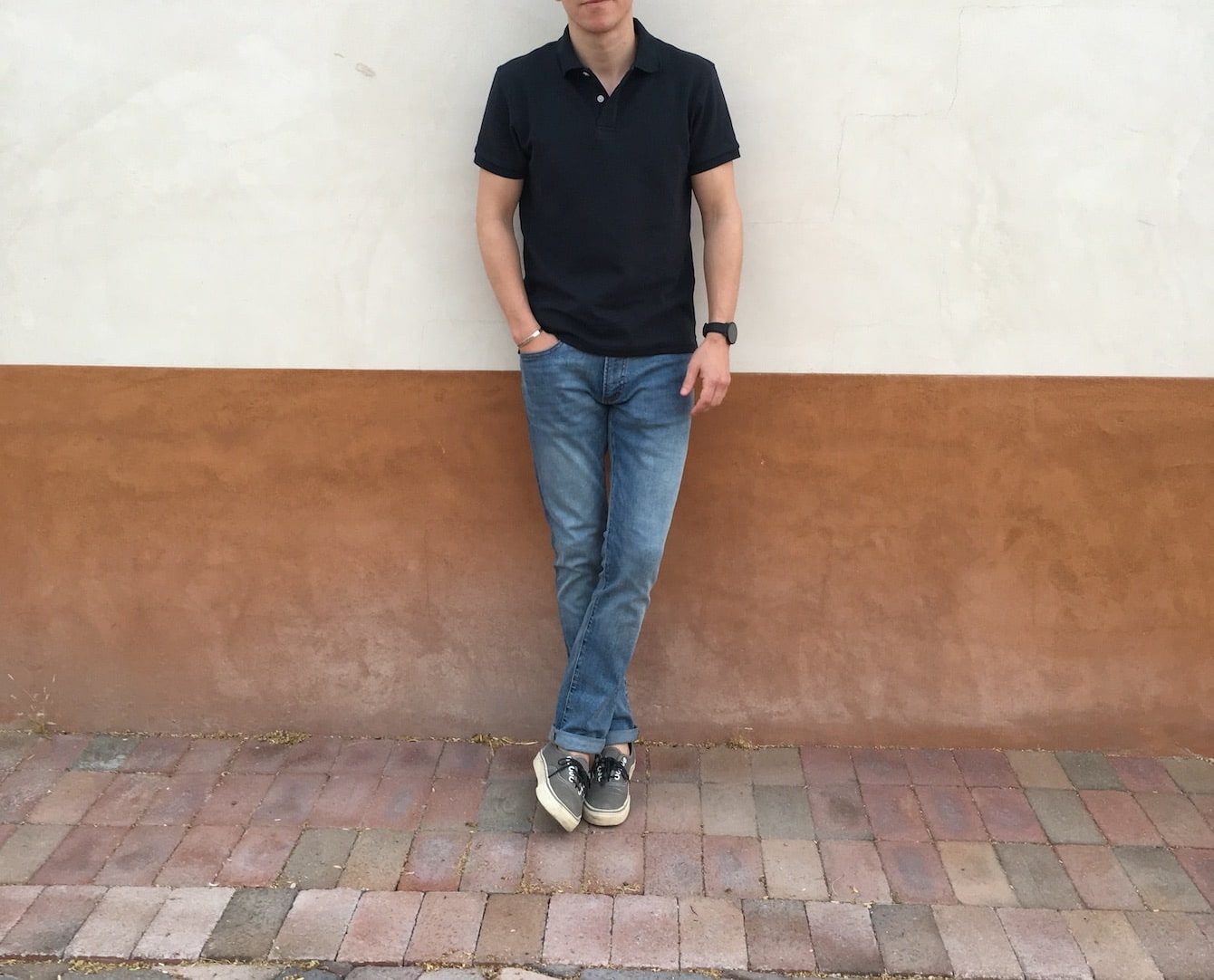 Brock wearing black PM James Polo