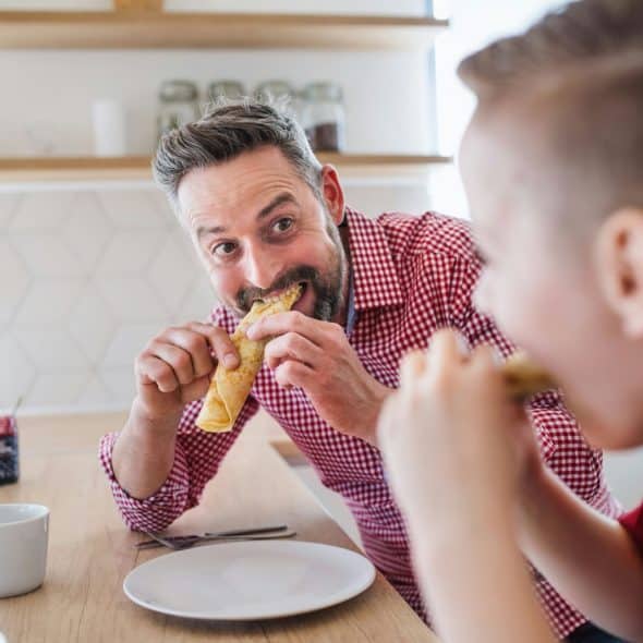 A man eating a food.