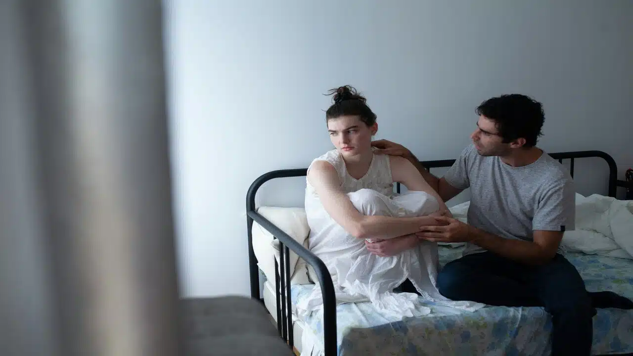 A man apologizing to his wife