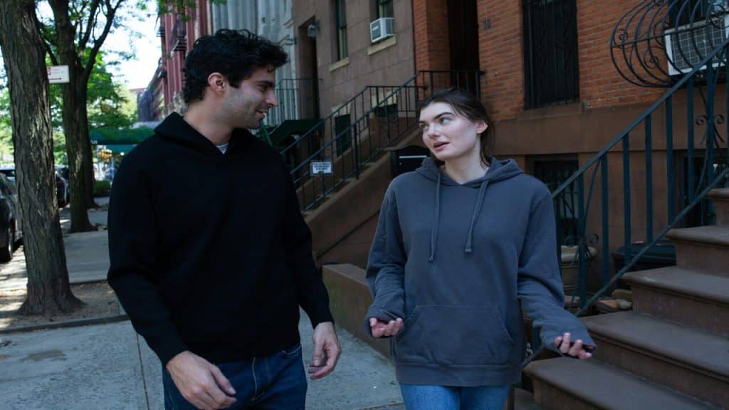 A couple talking outdoors.