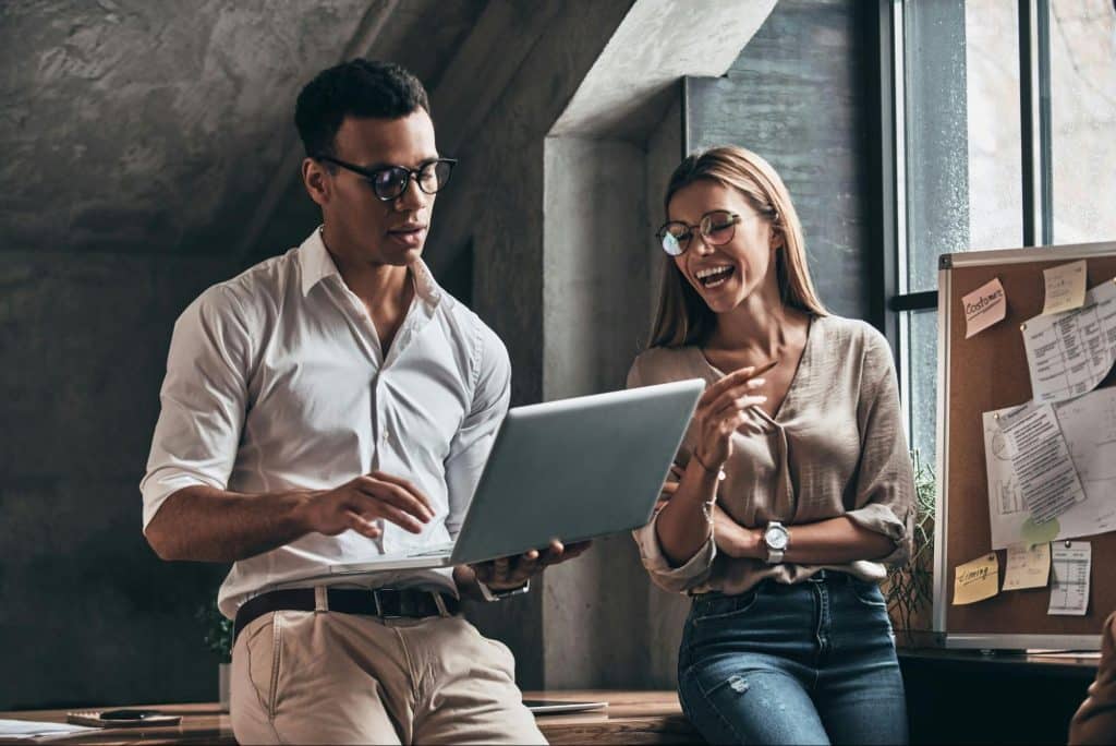 A woman laughing and a man ignoring her