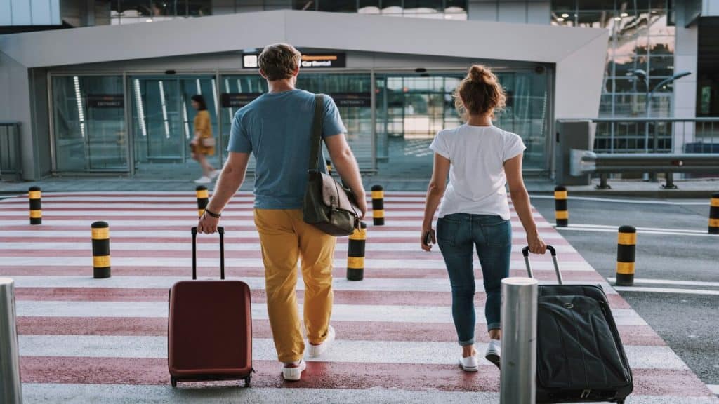 A couple walking to the airport.