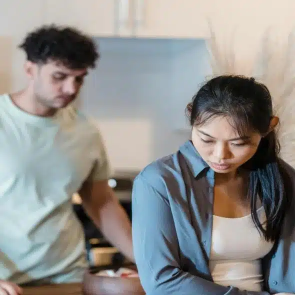 A couple having a serious talk at home