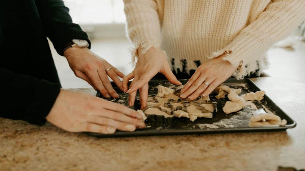 A couple baking together.