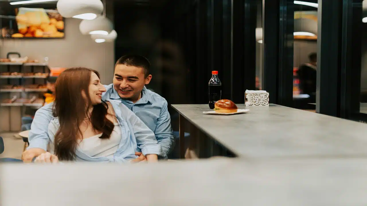 A couple spending time together at a cafe.