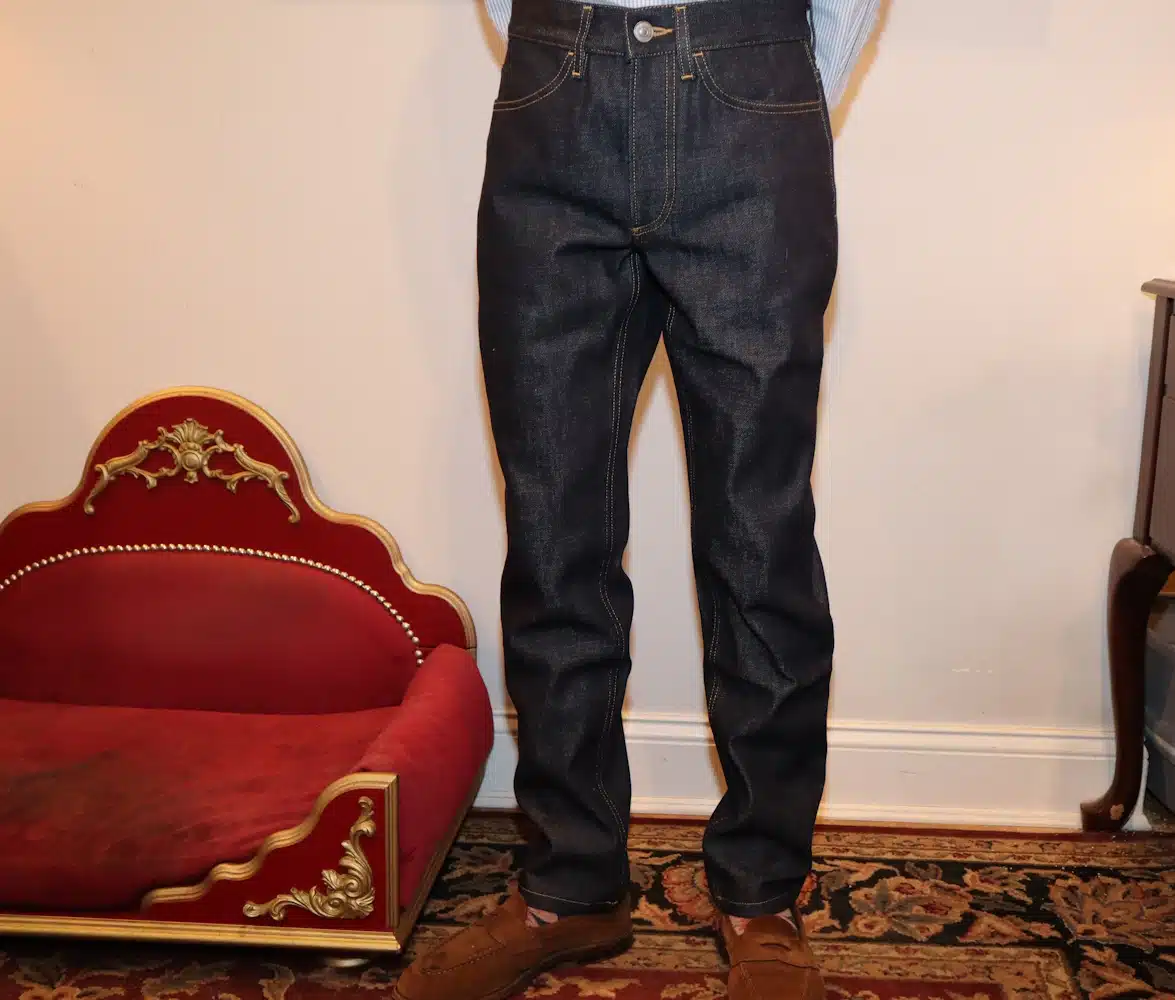 Karlton wearing The Asket Slim Jeans with brown shoes